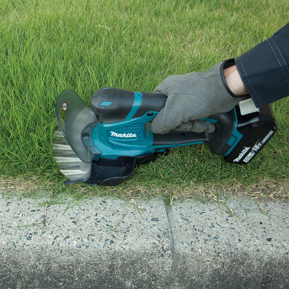 Makita Akku-Grasschere 18V DUM604ZX. Detailbild.