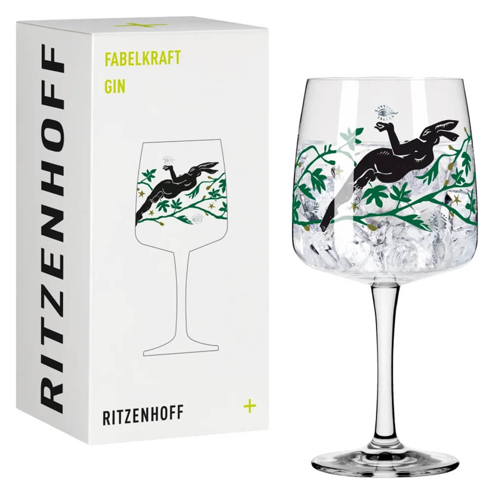 Das Ritzenhoff Ginglas "Fabelkraft" designed von Karin Rytter, zusammen mit dem passenden Karton, präsentiert sich vor einem weißen Hintergrund.